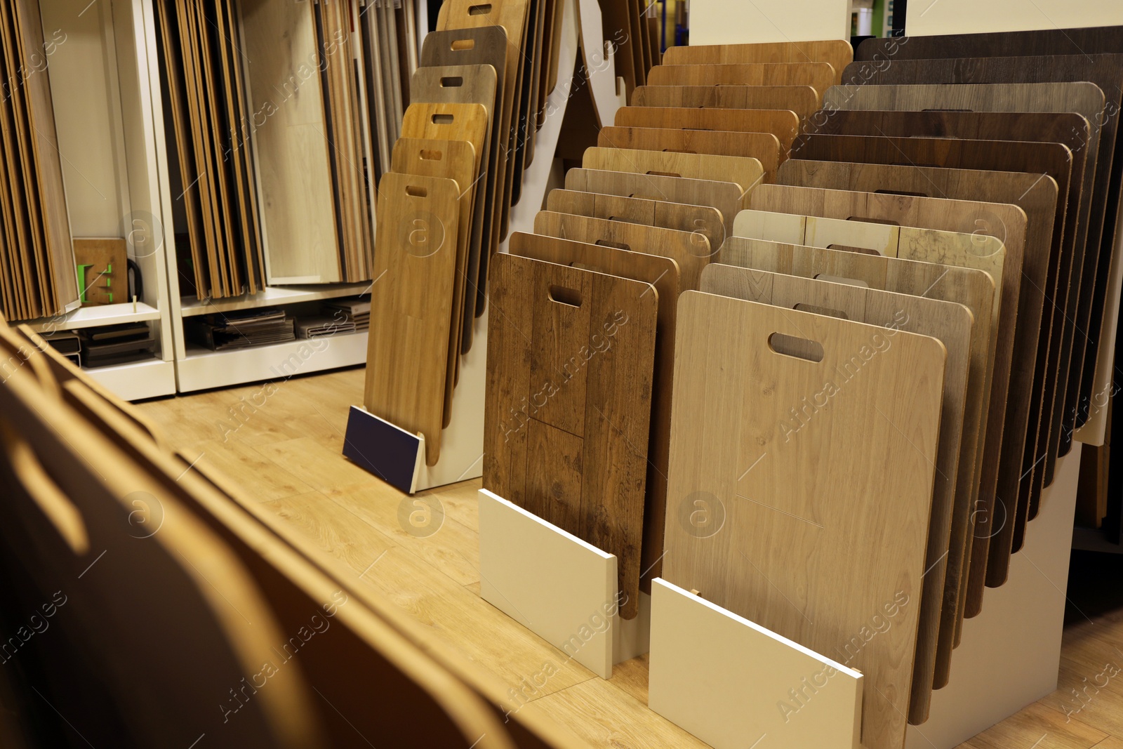 Photo of Many different samples of wooden flooring in store