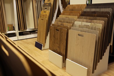 Photo of Many different samples of wooden flooring in store