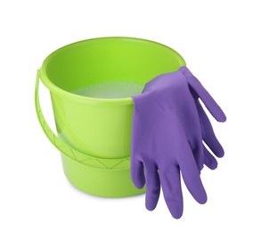 Photo of Green bucket with detergent and gloves on white background