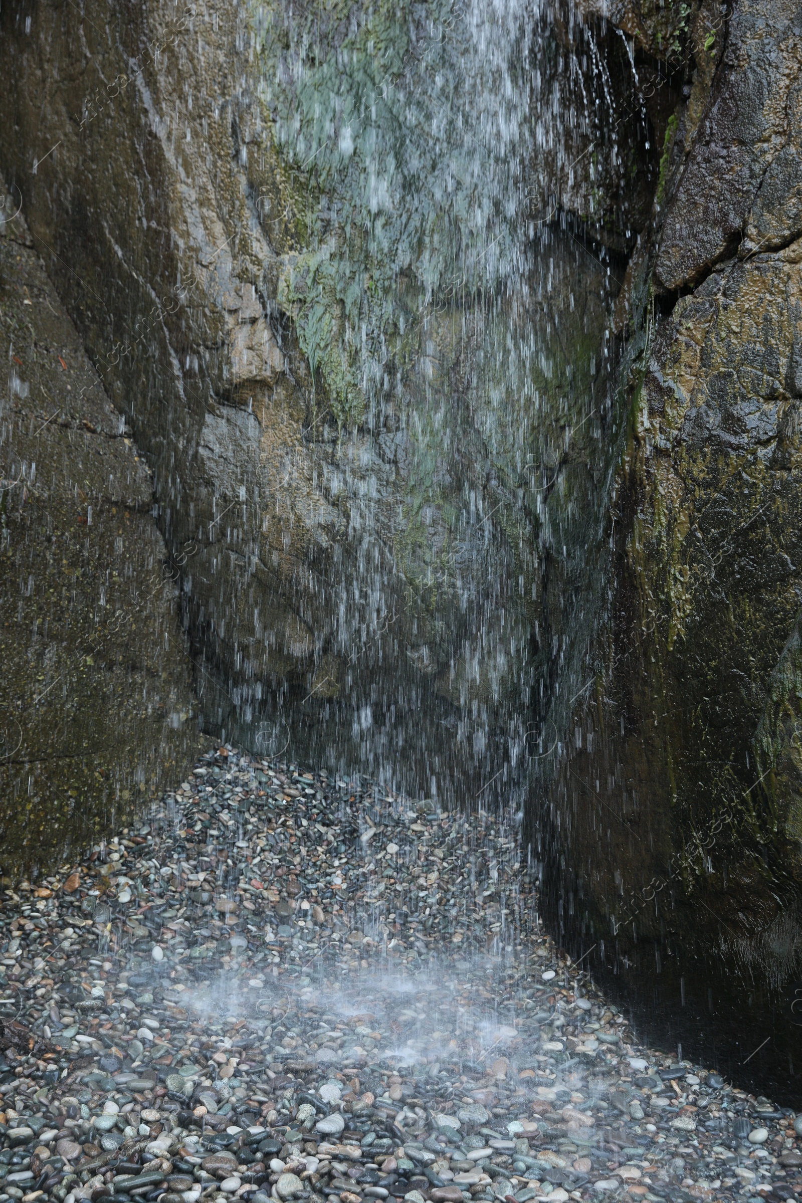 Photo of Picturesque view of beautiful mountain waterfall and rocks