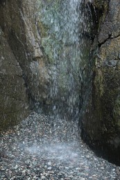 Picturesque view of beautiful mountain waterfall and rocks