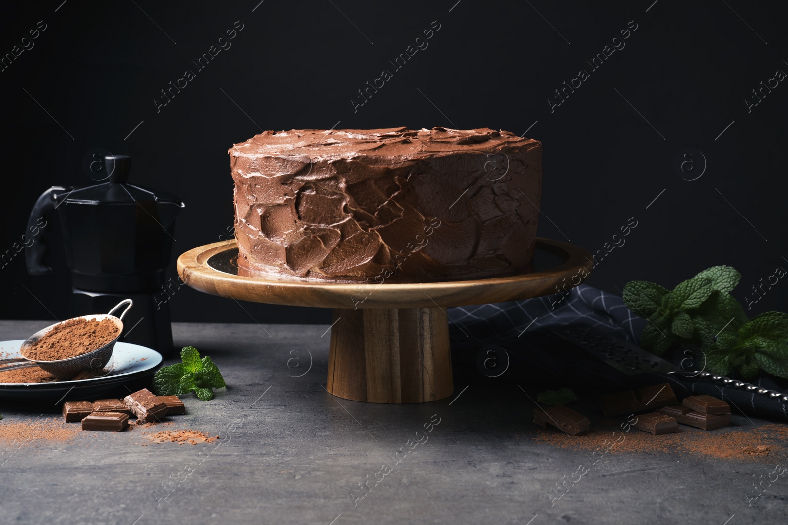 Photo of Composition with tasty homemade chocolate cake on table