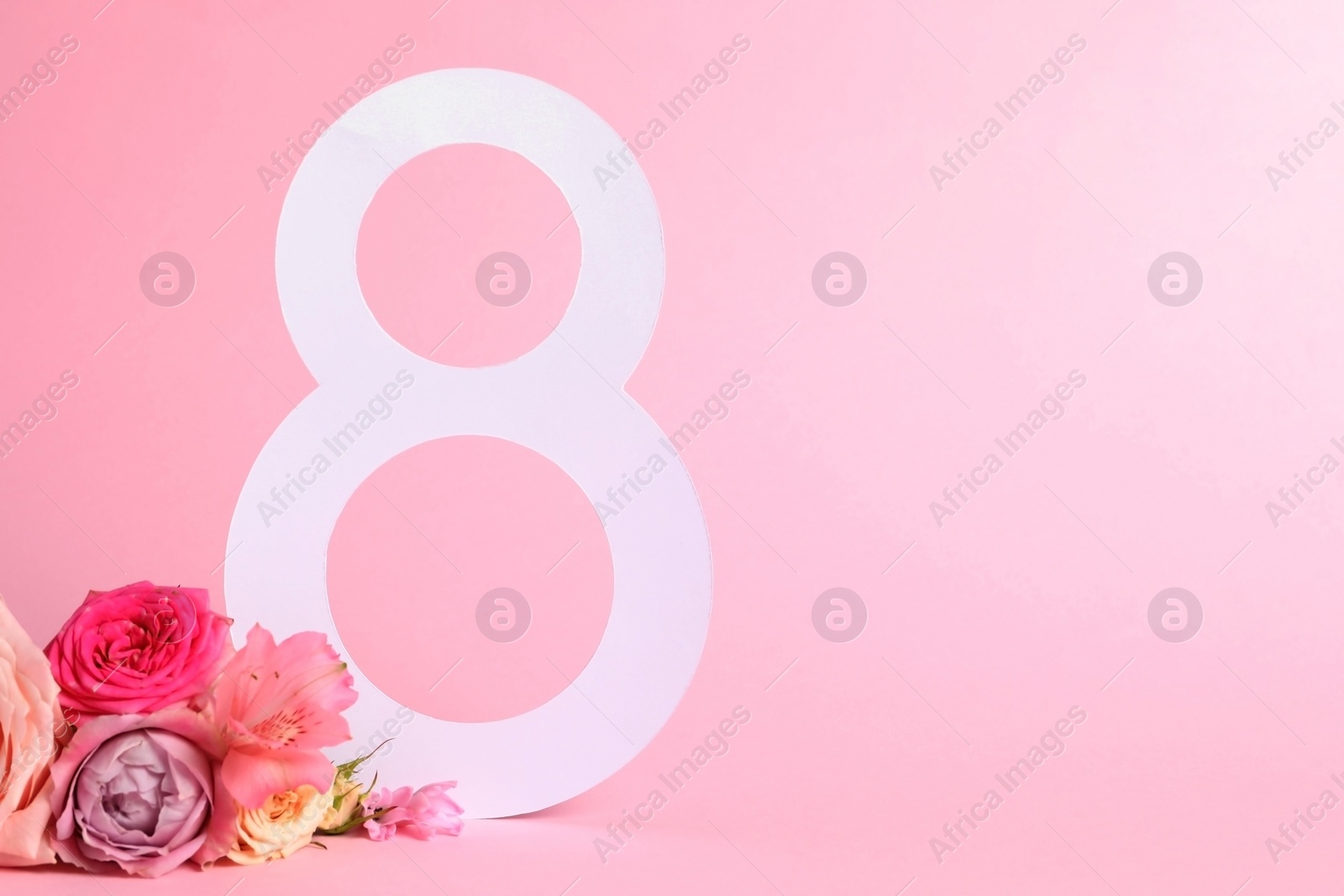 Photo of 8 March greeting card design with beautiful flowers on light pink background. Space for text