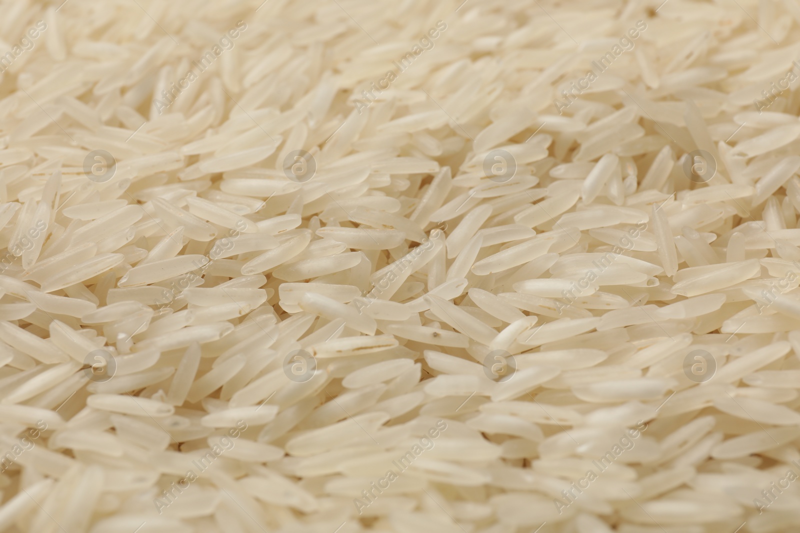 Photo of Raw basmati rice as background, closeup view