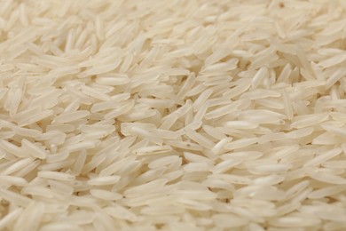 Photo of Raw basmati rice as background, closeup view