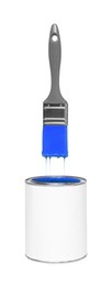 Image of Brush with blue paint in air over can on white background