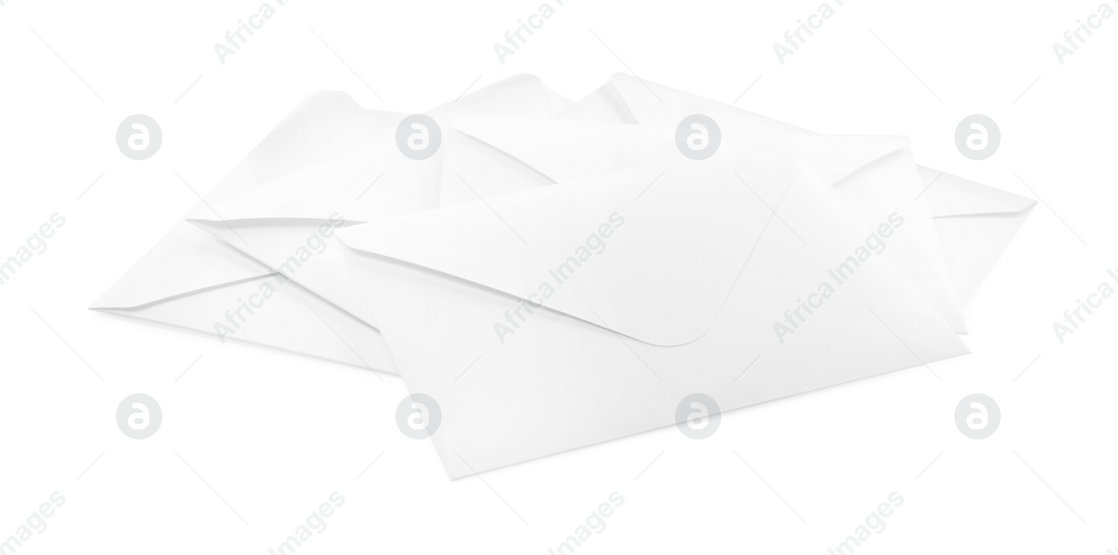 Photo of Heap of paper envelopes on white background