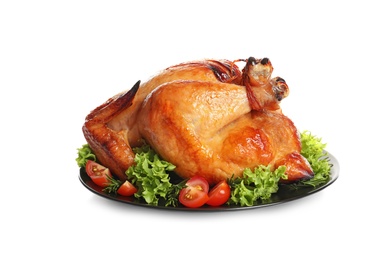 Photo of Platter of cooked turkey with garnish on white background