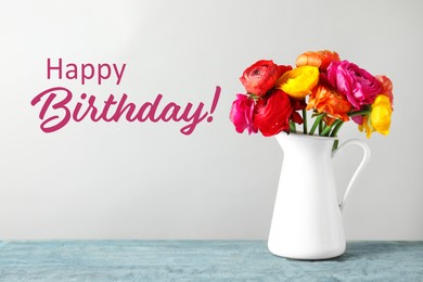 Happy Birthday! Vase with beautiful ranunculus flowers on table