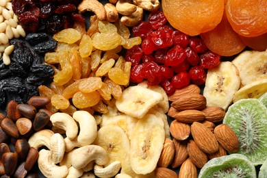 Photo of Different dried fruits and nuts as background, closeup