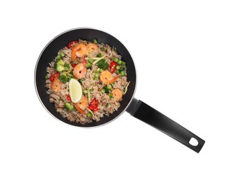 Photo of Tasty rice with shrimps and vegetables in frying pan isolated on white, top view