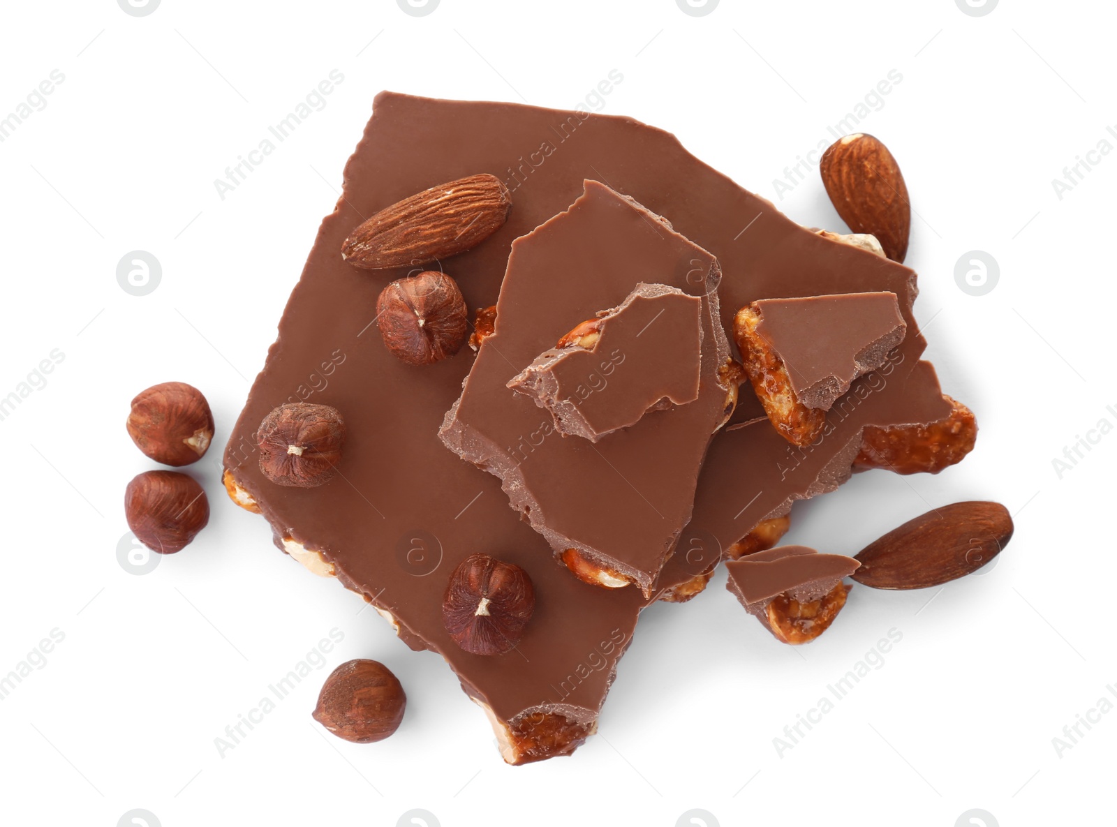 Photo of Delicious milk chocolate with nuts on white background, top view