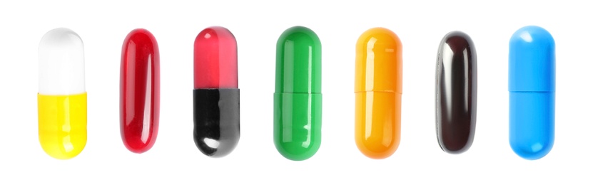 Image of Set with colorful pills on white background, top view. Banner design