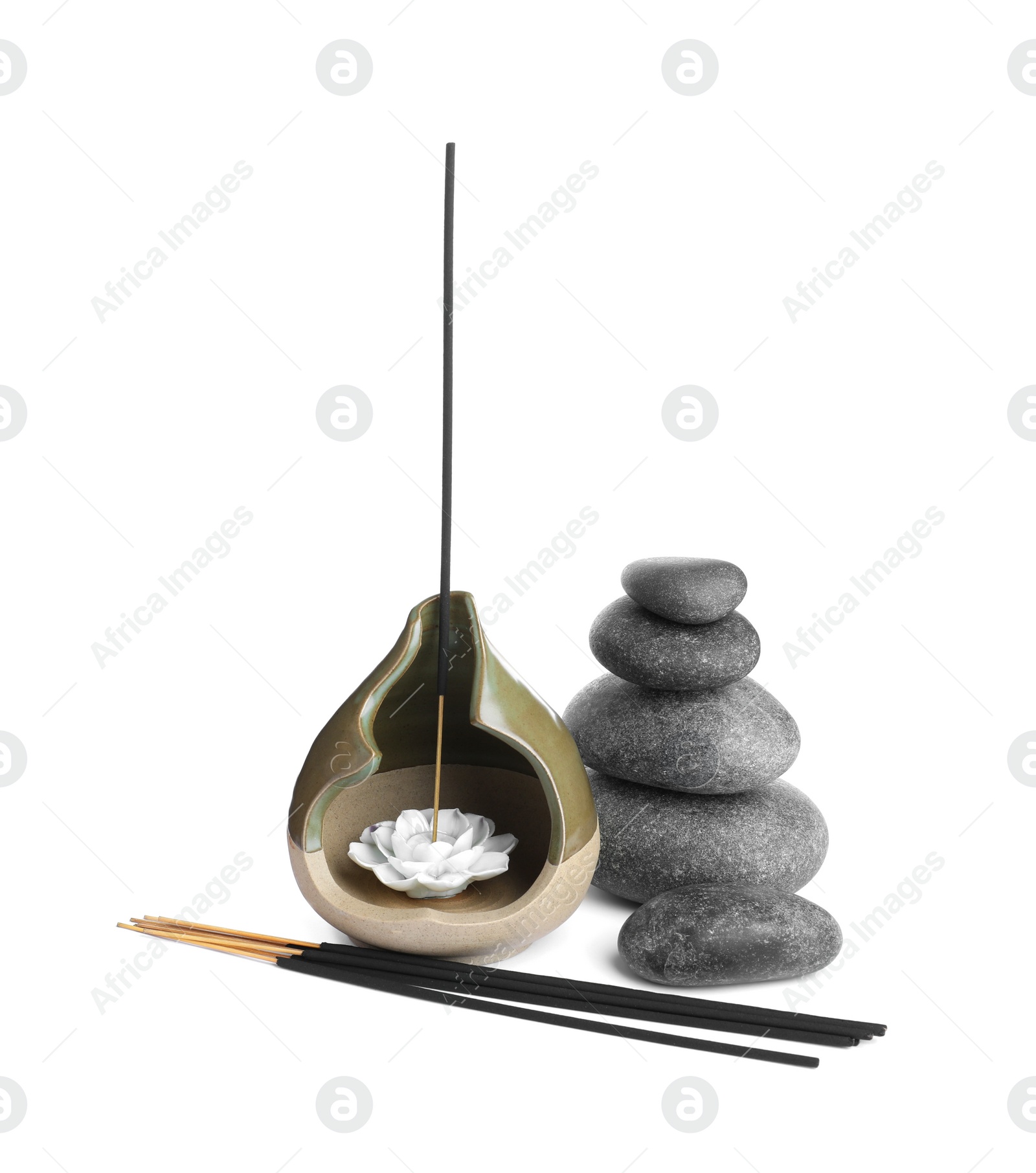 Photo of Aromatic incense sticks and spa stones on white background