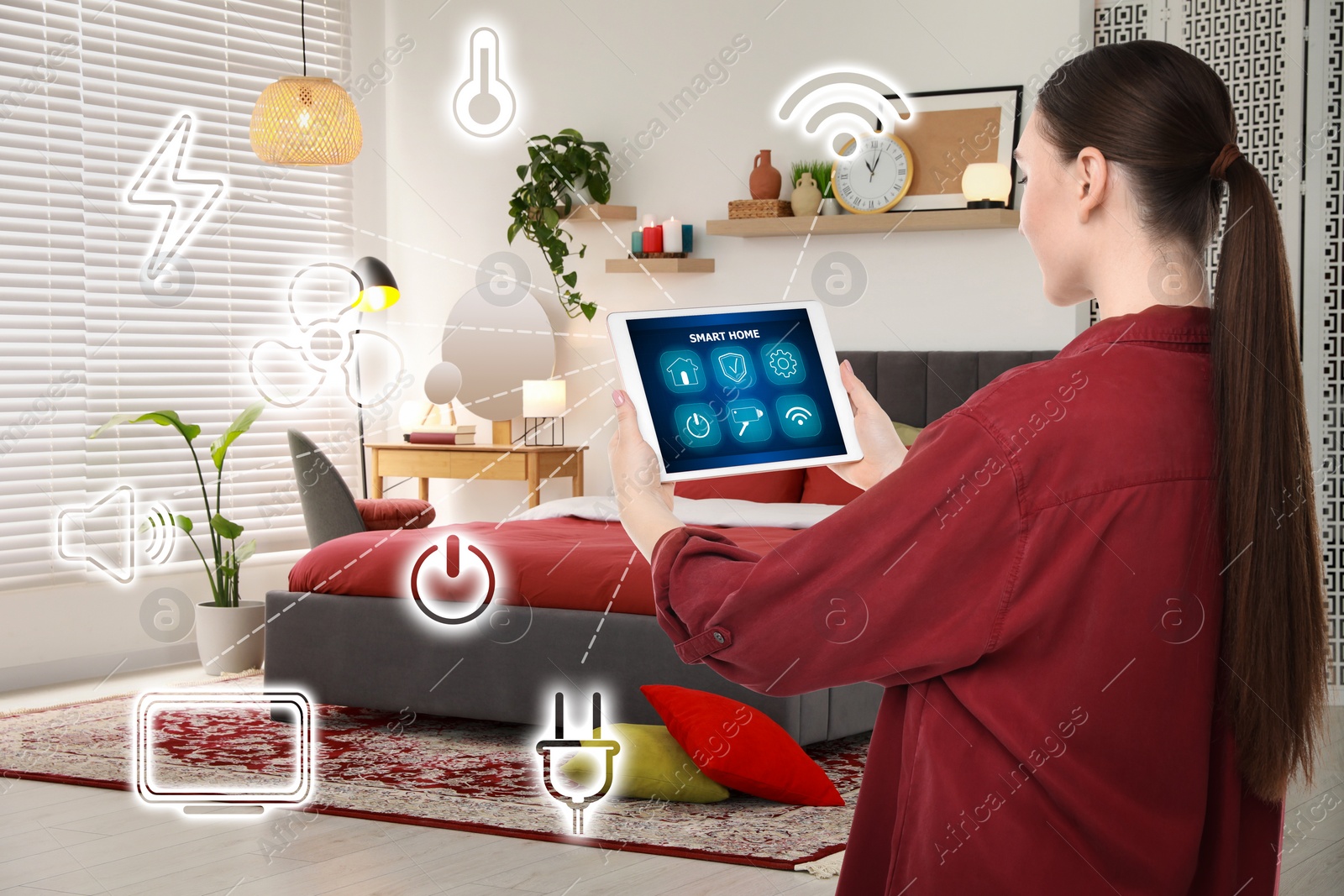 Image of Woman using smart home control system via application on tablet indoors. Different icons connected with device