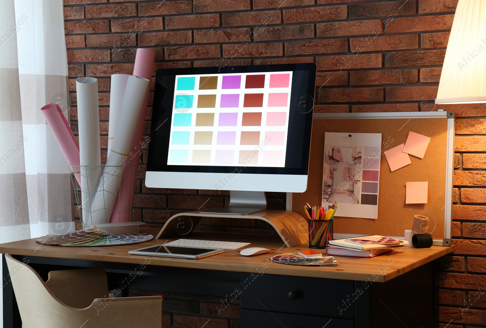 Photo of Modern computer and office supplies on wooden table. Designer's workplace