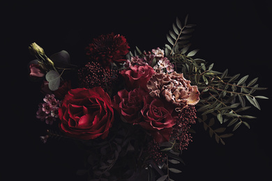 Photo of Beautiful bouquet of different flowers on black background. Floral card design with dark vintage effect