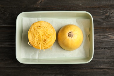 Photo of Cooked cut spaghetti squash in baking dish on table, top view