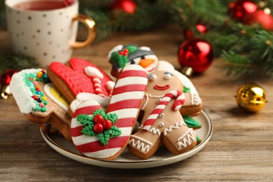 Photo of Delicious Christmas cookies on wooden table, closeup