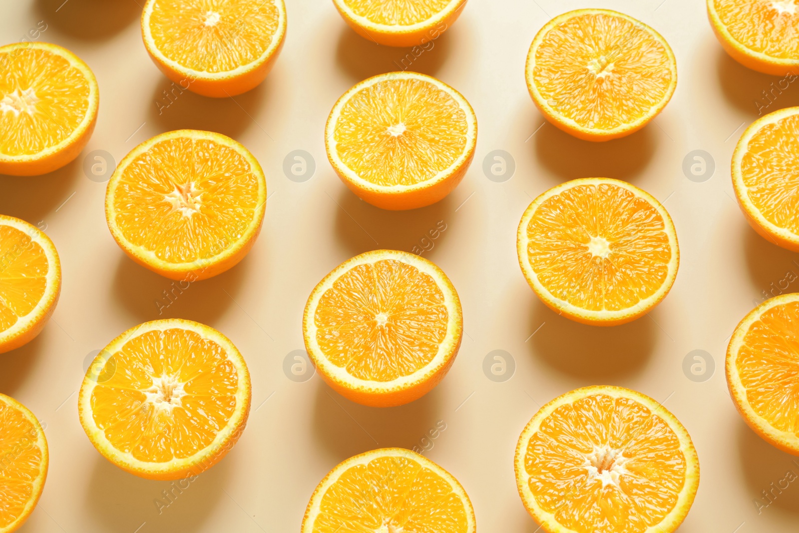 Photo of Composition with ripe oranges on color background