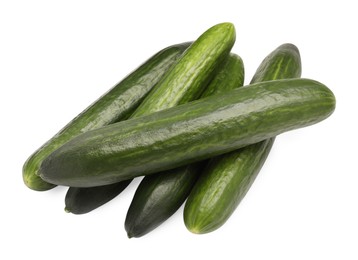 Photo of Many long fresh cucumbers isolated on white