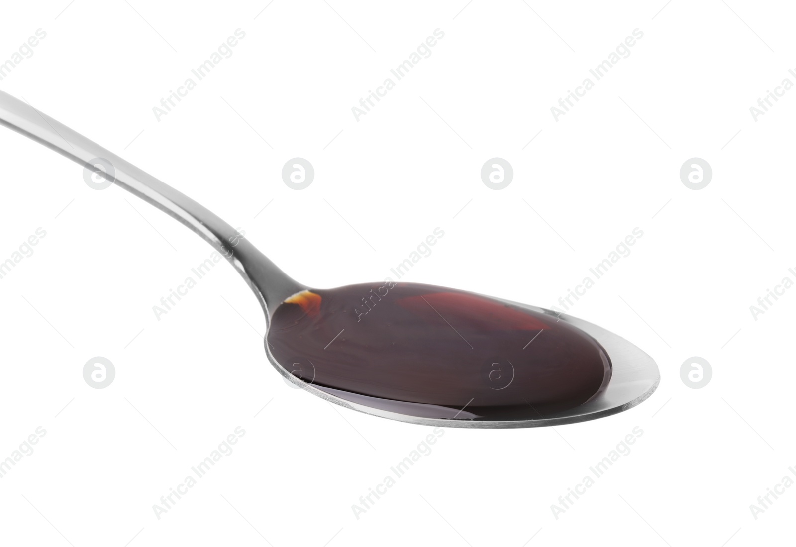 Photo of Spoon with delicious caramel syrup isolated on white