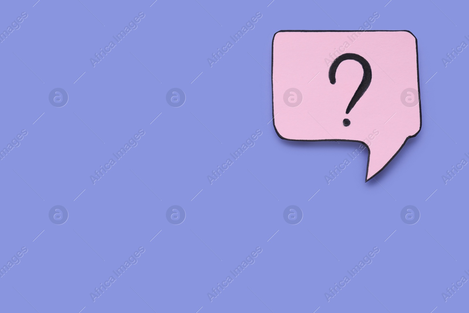 Photo of Paper speech bubble with question mark on violet background, top view. Space for text