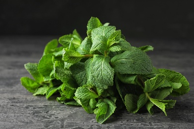 Bundle of fresh green mint on grey table