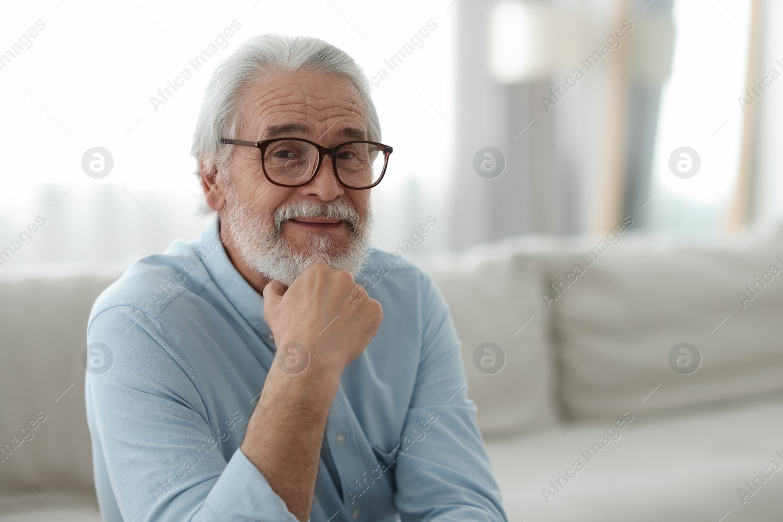 Photo of Portrait of grandpa with stylish glasses indoors, space for text