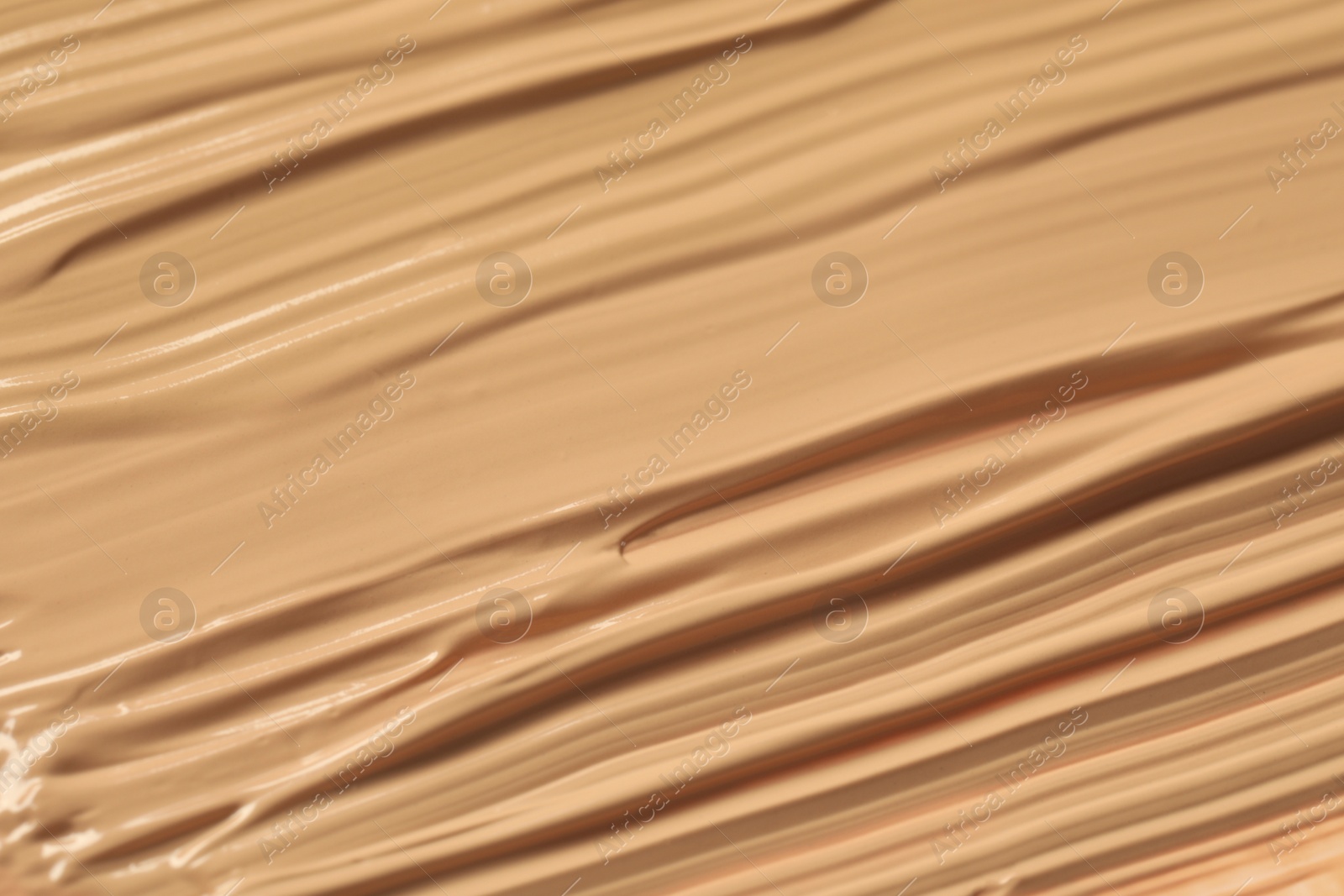 Photo of Texture of liquid skin foundation as background, closeup