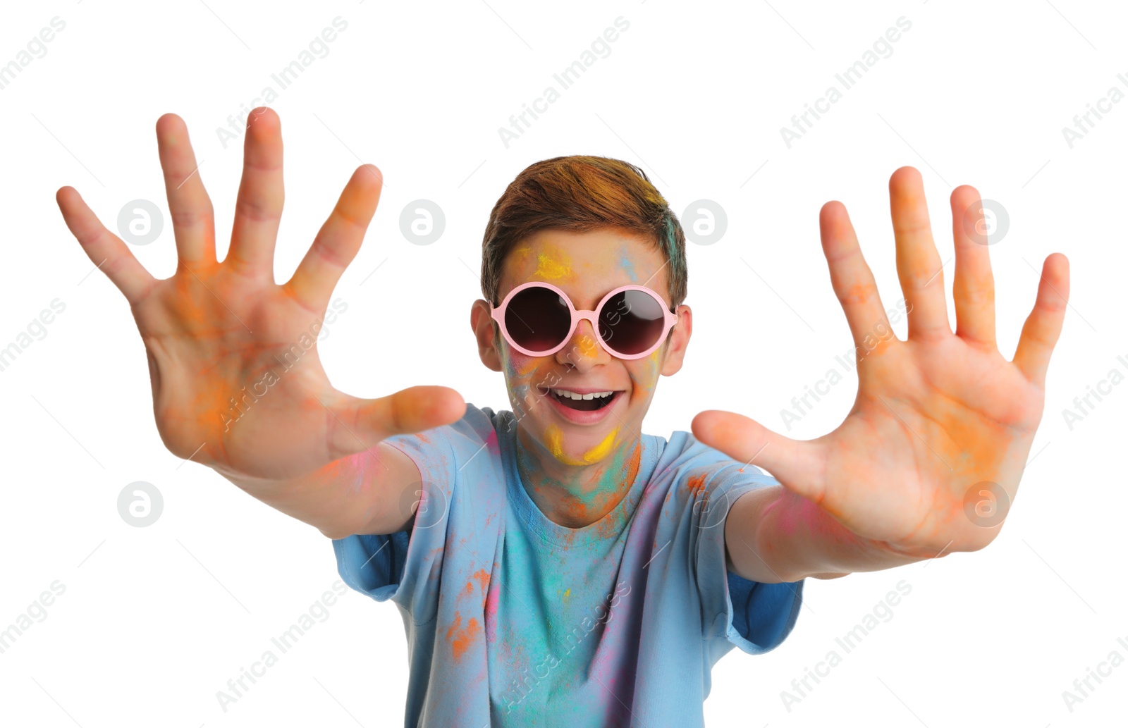 Photo of Teen boy covered with colorful powder dyes on white background. Holi festival celebration