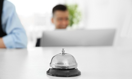 Photo of Service bell on reception desk in hotel