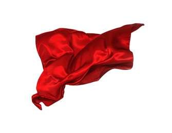 Photo of Beautiful delicate red silk floating on white background