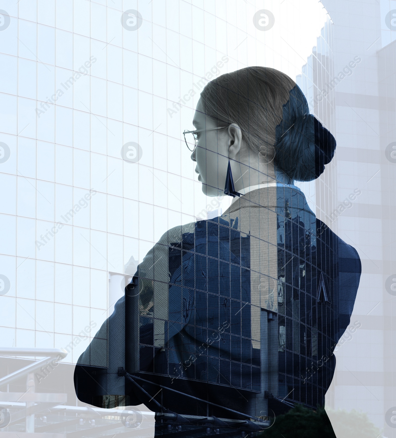 Image of Double exposure of businesswoman and office buildings