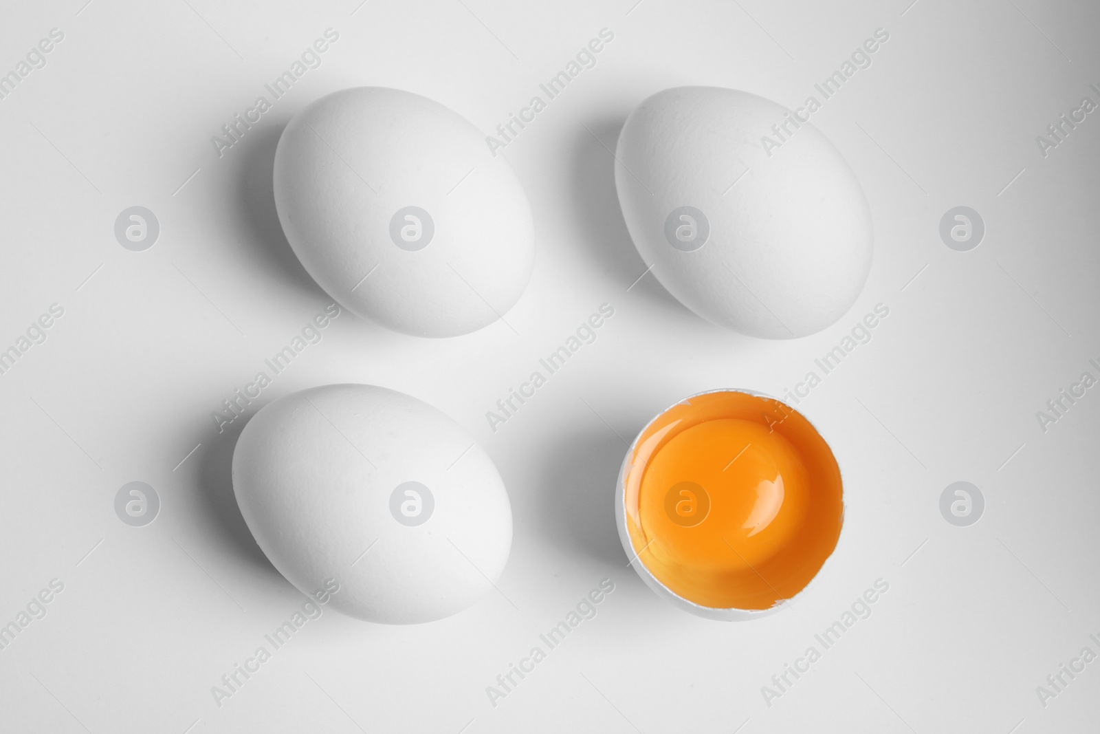 Photo of Fresh raw chicken eggs on white background, flat lay