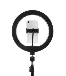 Photo of Tripod with ring light and smartphone isolated on white