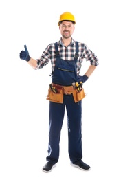 Full length portrait of professional construction worker with tool belt on white background