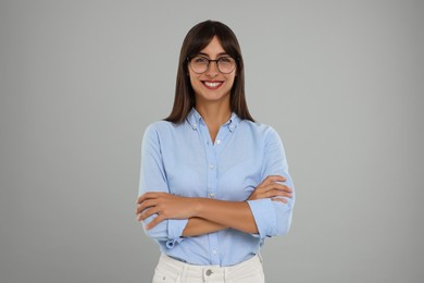 Photo of Portrait of happy secretary on light grey background