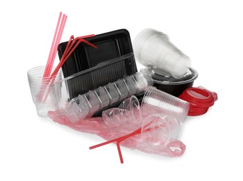 Photo of Pile of different plastic items on white background