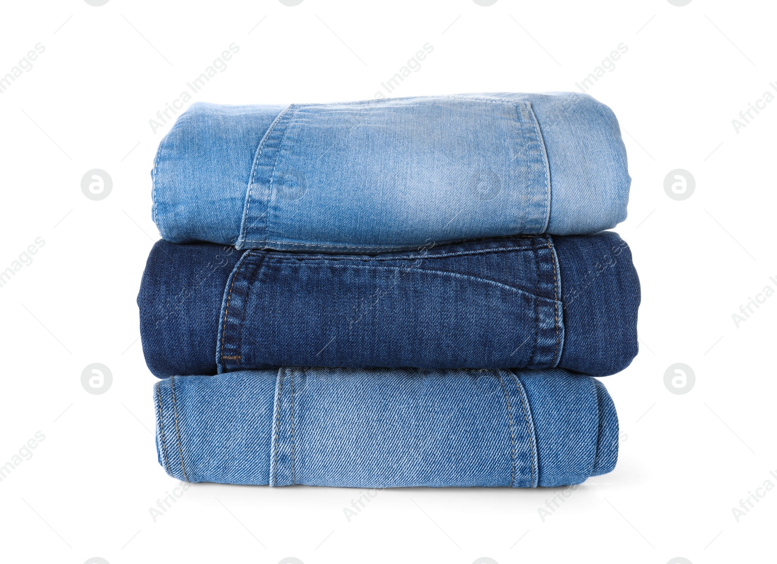 Photo of Stack of different jeans isolated on white