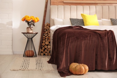 Cozy bedroom interior inspired by autumn color scheme