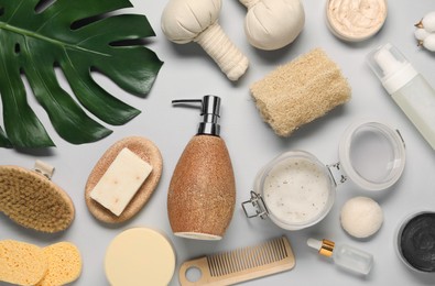 Bath accessories. Flat lay composition with personal care products on light grey background