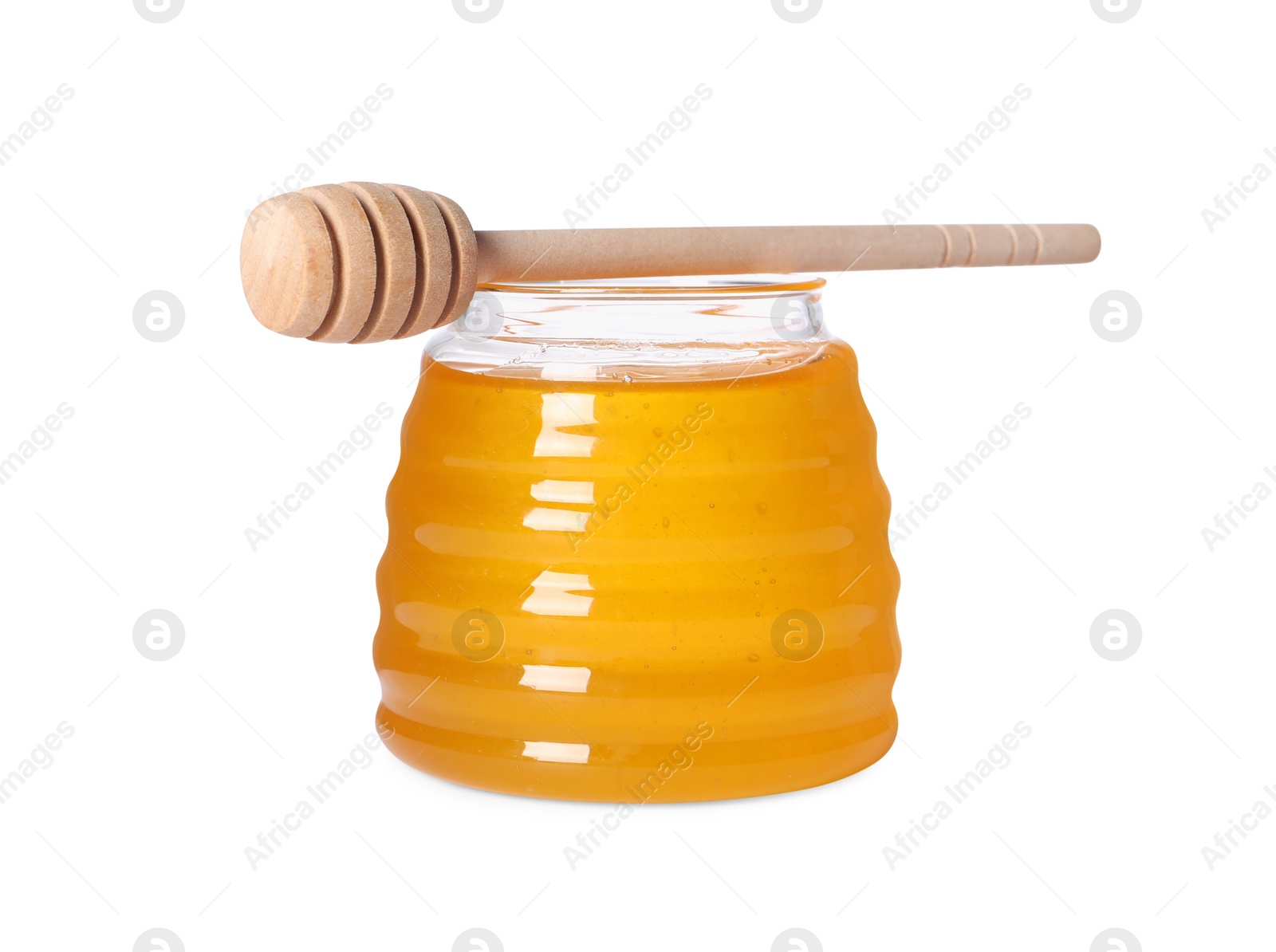 Photo of Tasty natural honey in glass jar and dipper isolated on white