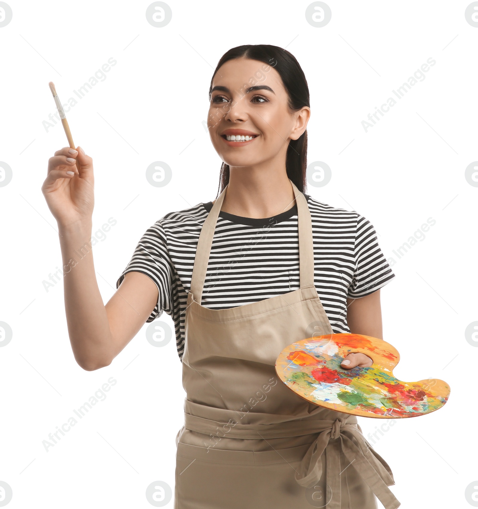 Photo of Young woman drawing with brush on white background