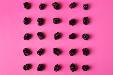 Photo of Flat lay composition with ripe blackberries on pink background