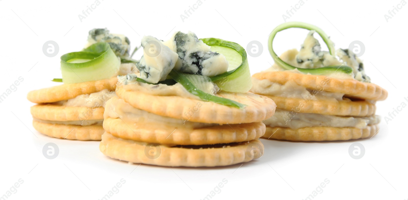 Photo of Delicious crackers with cheese and cucumber on white background