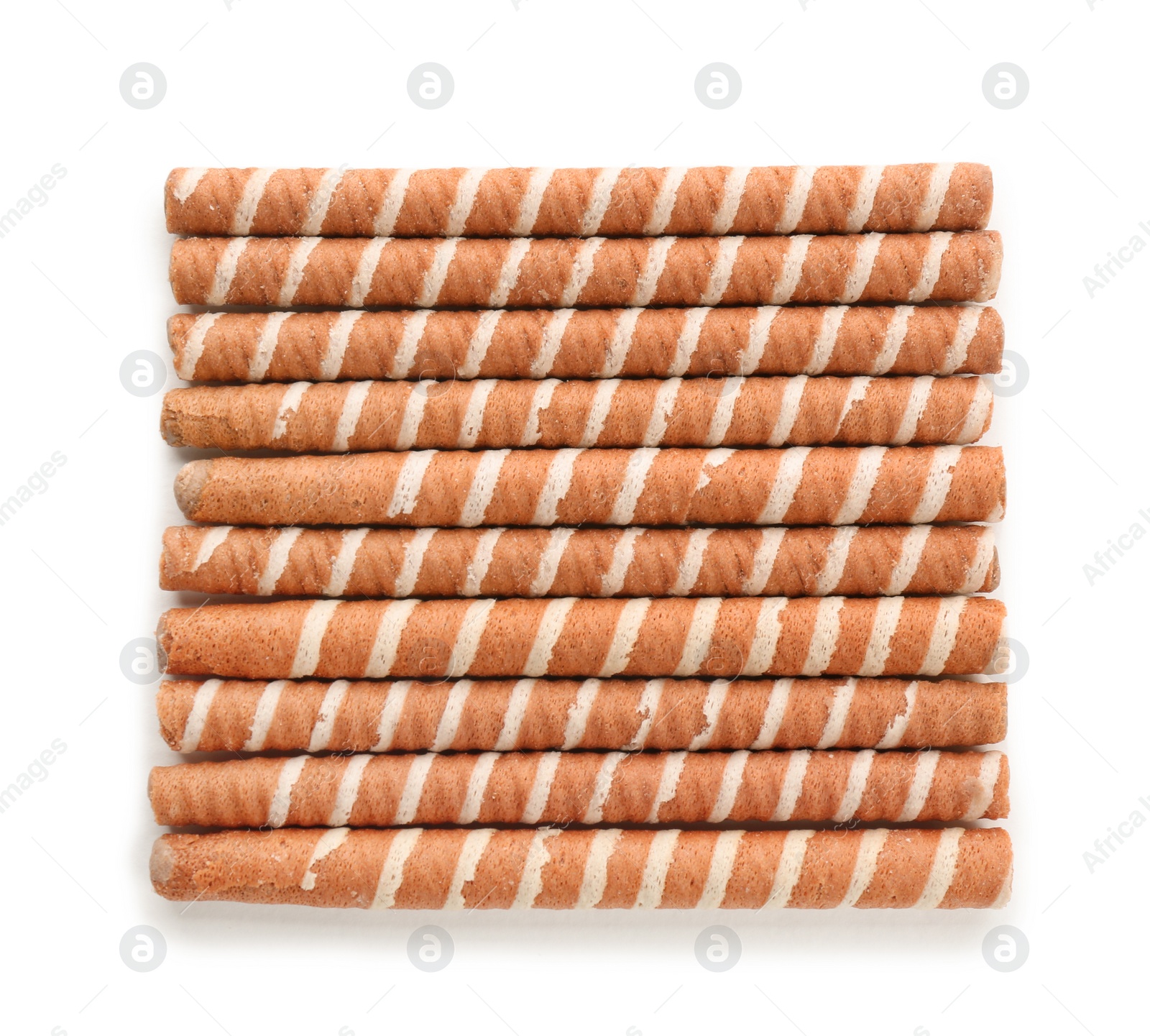 Photo of Tasty wafer roll sticks on white background, top view. Crispy food