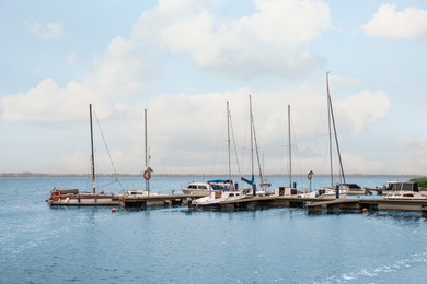 Photo of Pier with moored boats in sea for rent outdoors