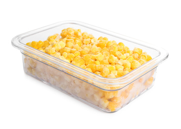 Photo of Frozen corn in plastic container isolated on white. Vegetable preservation