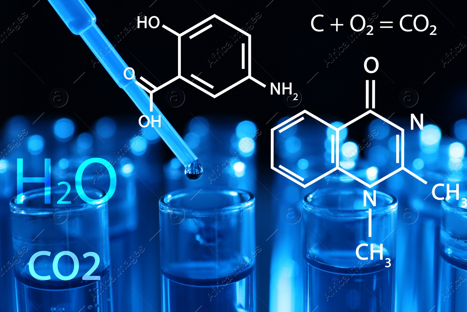 Image of Dripping reagent into test tube with liquid sample on dark background, closeup